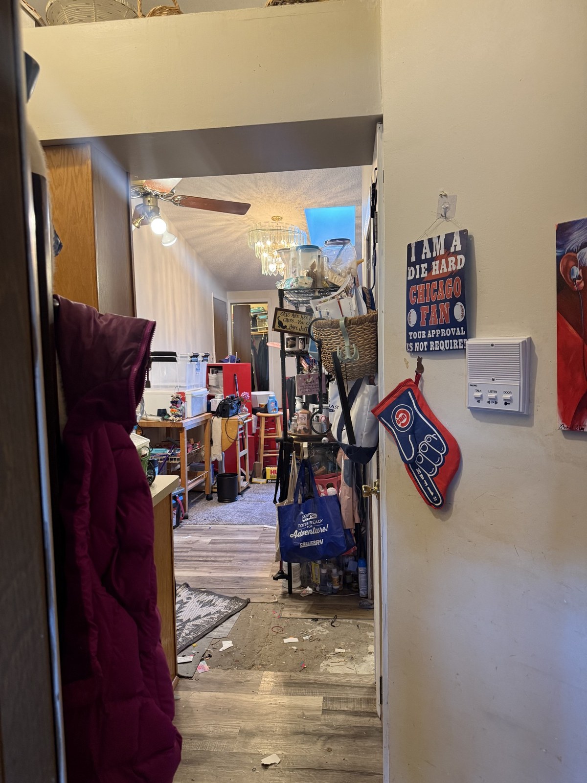 Clutter and debris in a hallway before cleanup