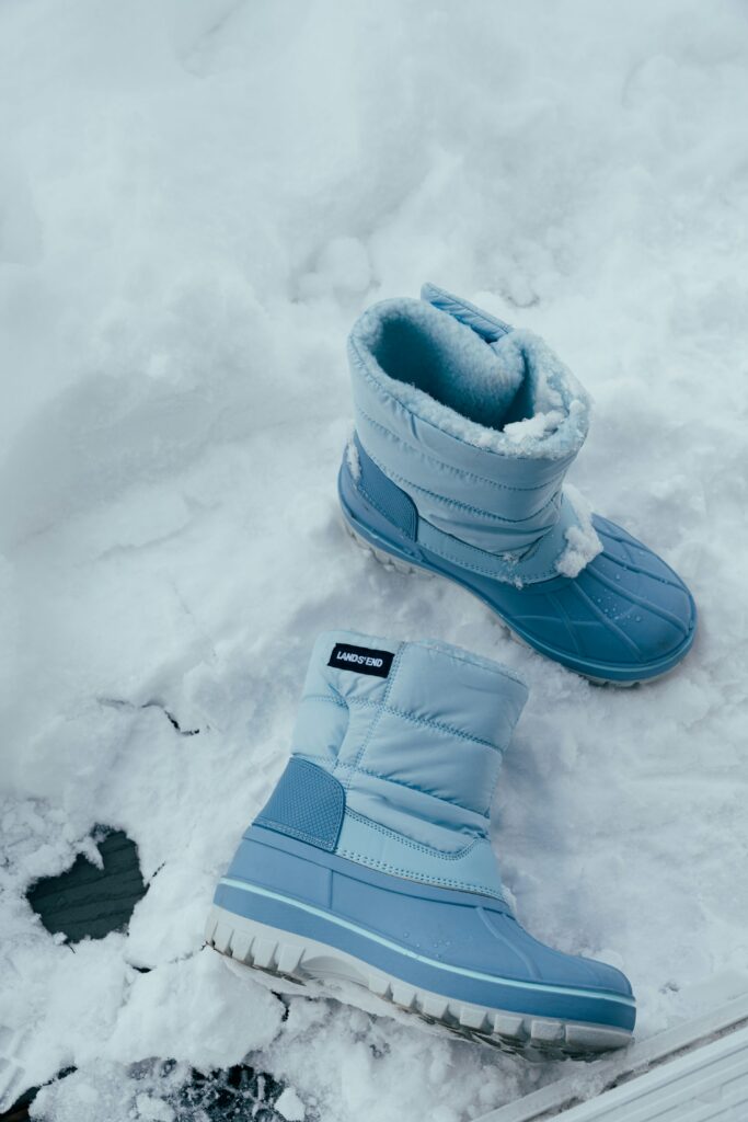 Winter boots in snow before entering the home